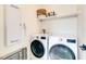 Bright laundry room with LG washer and dryer at 6506 Gulf Dr, Holmes Beach, FL 34217
