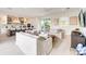 Open living and kitchen area with a modern design and light flooring at 6506 Gulf Dr, Holmes Beach, FL 34217