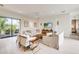 Spacious living room with light walls, comfortable seating, and large windows at 6506 Gulf Dr, Holmes Beach, FL 34217