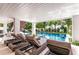 Relaxing patio furniture with views of the refreshing pool at 6506 Gulf Dr, Holmes Beach, FL 34217