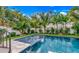 Relaxing poolside view with tropical landscaping and a tranquil atmosphere at 6506 Gulf Dr, Holmes Beach, FL 34217