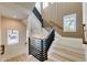 Stylish staircase with metal railing and wood accents at 6506 Gulf Dr, Holmes Beach, FL 34217