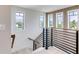 Stylish staircase with modern railing and light wood accents at 6506 Gulf Dr, Holmes Beach, FL 34217