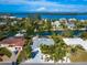 Aerial view of waterfront home and neighborhood at 671 Emerald Harbor Dr, Longboat Key, FL 34228