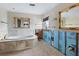 Bathroom with a large bathtub and needs renovation at 671 Emerald Harbor Dr, Longboat Key, FL 34228