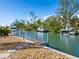 Private dock with access to the waterway and boats at 671 Emerald Harbor Dr, Longboat Key, FL 34228