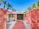 Mid-century modern home with unique entryway and walkway at 671 Emerald Harbor Dr, Longboat Key, FL 34228