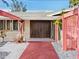 Mid-century modern home with unique entryway and walkway at 671 Emerald Harbor Dr, Longboat Key, FL 34228