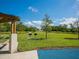 Park with picnic tables and grills under a covered pavilion at 671 Emerald Harbor Dr, Longboat Key, FL 34228