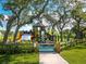 Wooden playground structure with slides and climbing features at 671 Emerald Harbor Dr, Longboat Key, FL 34228