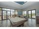 Stylish billiard room with a pool table, dining area, and large windows offering natural light and lovely views at 7115 Callander Cv, Lakewood Ranch, FL 34202