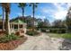 Charming gazebo set amidst lush landscaping, provides a tranquil space for relaxation at 7115 Callander Cv, Lakewood Ranch, FL 34202