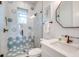 Bathroom with a walk-in shower and hexagonal tile at 9403 Gulf Dr, Anna Maria, FL 34216