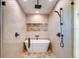 Modern bathroom with walk-in shower, soaking tub, and patterned tile at 9403 Gulf Dr, Anna Maria, FL 34216
