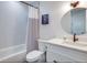 Bathroom with tub, shower, and nautical decor at 9403 Gulf Dr, Anna Maria, FL 34216