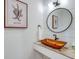 Bathroom with vessel sink, modern fixtures and decorative wall at 9403 Gulf Dr, Anna Maria, FL 34216