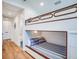 Bunk bed bedroom with built in lower bed and ocean theme at 9403 Gulf Dr, Anna Maria, FL 34216