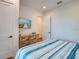 Bedroom with a king-size bed and access to a balcony at 9403 Gulf Dr, Anna Maria, FL 34216