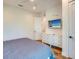 Bedroom with king-size bed, dresser, and wall-mounted TV at 9403 Gulf Dr, Anna Maria, FL 34216