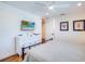 Bedroom with king-size bed, dresser, and wall-mounted TV at 9403 Gulf Dr, Anna Maria, FL 34216