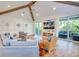 Spacious living area with access to a private balcony and hardwood floors at 9403 Gulf Dr, Anna Maria, FL 34216