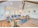 Open living space featuring a sectional sofa and hardwood floors at 9403 Gulf Dr, Anna Maria, FL 34216