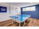 Playroom with ping pong table and wood floors at 9403 Gulf Dr, Anna Maria, FL 34216