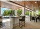 Outdoor kitchen, dining area, hot tub, and pool at 9403 Gulf Dr, Anna Maria, FL 34216