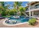 Resort-style pool with a spa and expansive wooden deck at 9403 Gulf Dr, Anna Maria, FL 34216