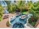 Elevated view of resort-style pool, spa, and deck at 9403 Gulf Dr, Anna Maria, FL 34216