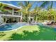 Expansive pool with putting green and lush landscaping at 9403 Gulf Dr, Anna Maria, FL 34216