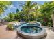 Luxury pool and spa with a tropical landscaping and deck at 9403 Gulf Dr, Anna Maria, FL 34216
