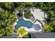 Aerial view of unique freeform pool and surrounding oasis at 9407 Gulf Dr, Anna Maria, FL 34216