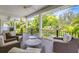 Relaxing outdoor balcony with wicker seating and tropical views at 9407 Gulf Dr, Anna Maria, FL 34216