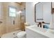 Bathroom with a walk-in shower and modern vanity at 9407 Gulf Dr, Anna Maria, FL 34216