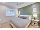 Bright bedroom with a queen bed and stylish geometric wall accents at 9407 Gulf Dr, Anna Maria, FL 34216