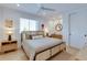 Bedroom with stylish decor and private balcony at 9407 Gulf Dr, Anna Maria, FL 34216