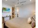 Bedroom with ensuite bathroom and mounted TV at 9407 Gulf Dr, Anna Maria, FL 34216