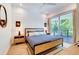 Main bedroom with private balcony and stylish decor at 9407 Gulf Dr, Anna Maria, FL 34216