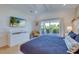 Spacious bedroom with a comfortable bed and private balcony access at 9407 Gulf Dr, Anna Maria, FL 34216