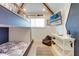 Stylish bunk room with built-in bunks, TV, and ample storage at 9407 Gulf Dr, Anna Maria, FL 34216