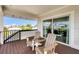 Private deck with wooden chairs, offering scenic views at 9407 Gulf Dr, Anna Maria, FL 34216
