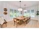 Bright dining room with a large wooden table and comfortable seating at 9407 Gulf Dr, Anna Maria, FL 34216