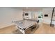 Game room with ping pong table and wood flooring at 9407 Gulf Dr, Anna Maria, FL 34216
