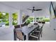 Outdoor dining area with seating for eight, near the pool at 9407 Gulf Dr, Anna Maria, FL 34216