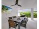 Outdoor patio with large dining table and comfortable seating at 9407 Gulf Dr, Anna Maria, FL 34216