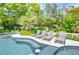 Enjoy the sun on comfortable lounge chairs by the pool at 9407 Gulf Dr, Anna Maria, FL 34216