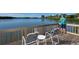 Relaxing fishing deck overlooking the water with seating at 1709 Pelican Cove Rd # Gl445, Sarasota, FL 34231