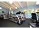 Community fitness center with treadmills and weight equipment at 1709 Pelican Cove Rd # Gl445, Sarasota, FL 34231