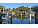 Peaceful waterfront marina with numerous boats and docks at 1709 Pelican Cove Rd # Gl445, Sarasota, FL 34231